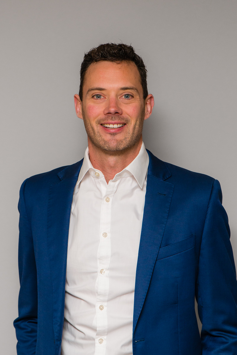 Standout professional headshot with strong lighting