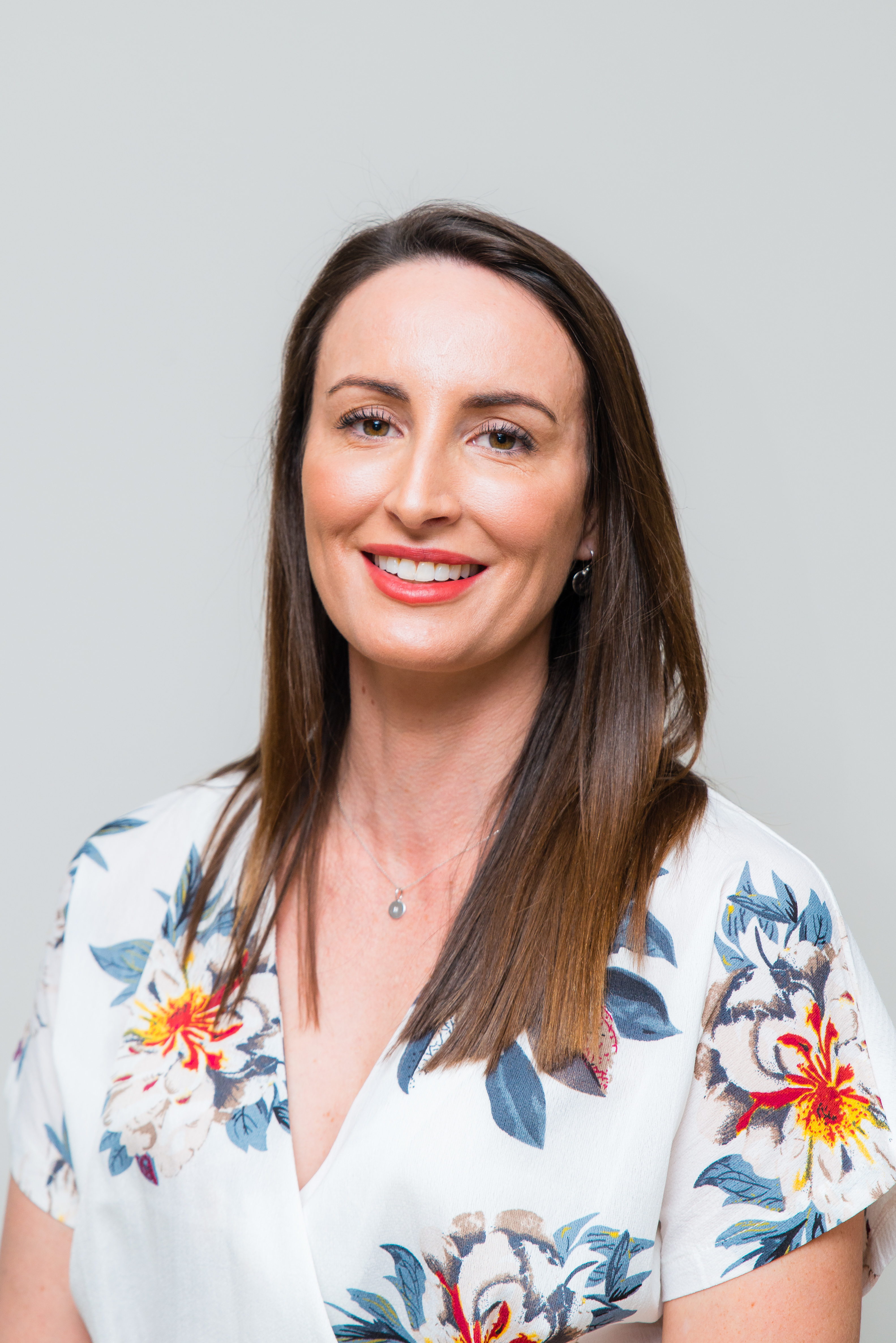Person in formal attire for a headshot